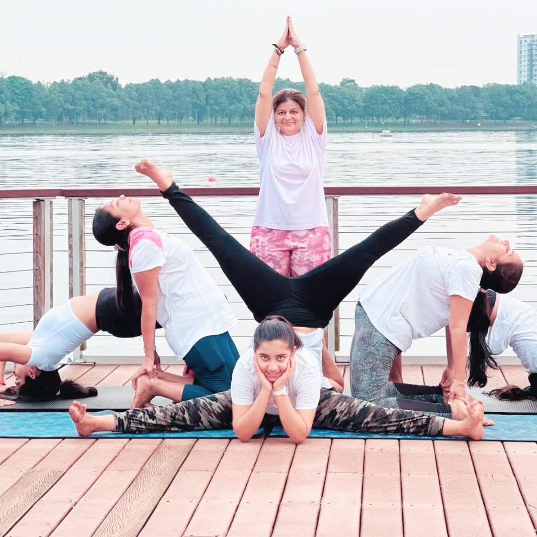 Community group pose by the water